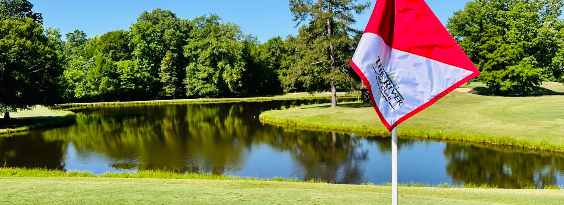 Red and white flag on golf course